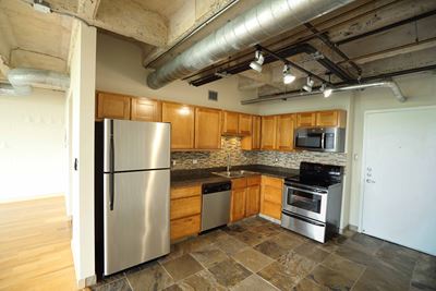 Industrial aesthetic exposed ceilings and tile floor